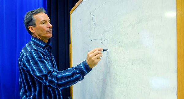 Professor Dennis teaching 