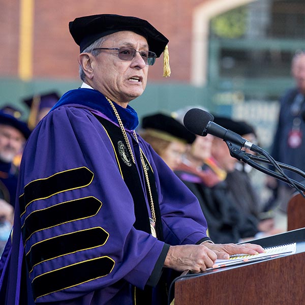 Professor speaking at a commencement