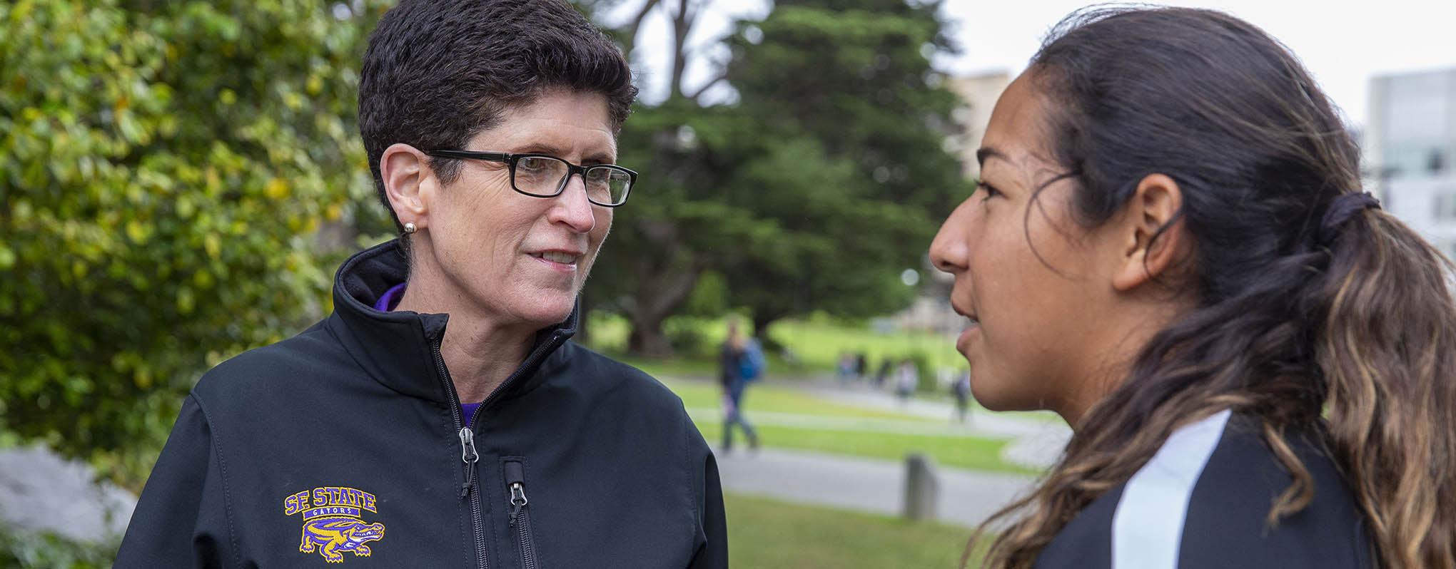 President Mahoney speaks with student