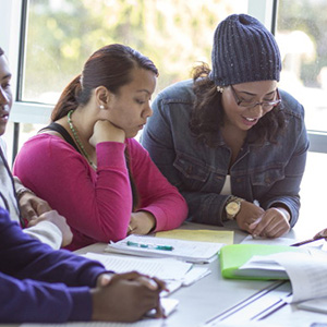 Two students working at a table together