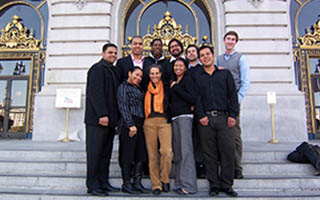 A group of fellows on the steps of San Francisco City Hall