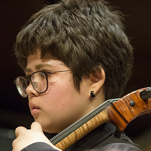 Student playing an instrument