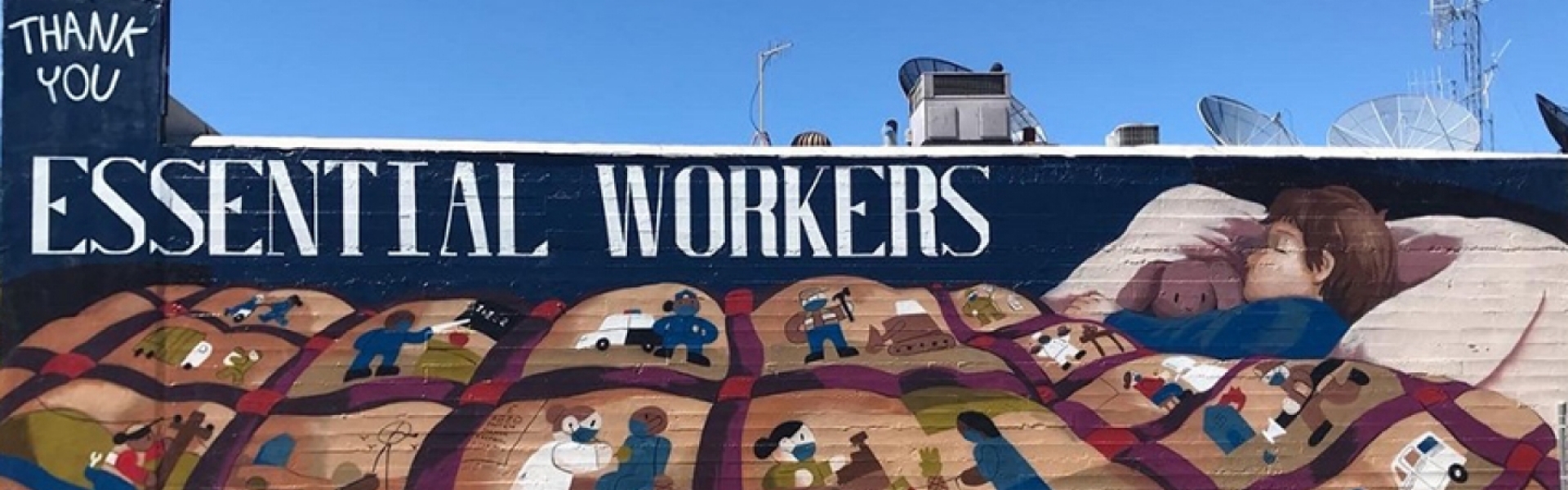 essential workers mural on side of building