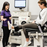 Kinesiology lab with two women, a researcher and patient