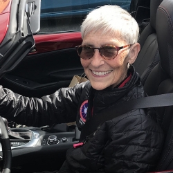 Emerita Ann Hallum driving her car