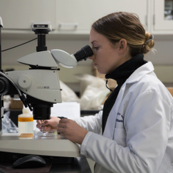 scientist with microscope