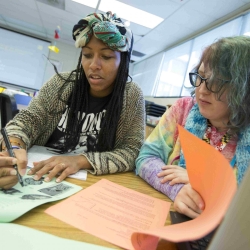 Students helping each other on a project