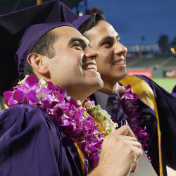 Students celebrating graduating at commencement