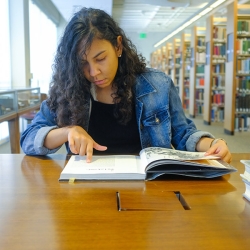 student reading at table