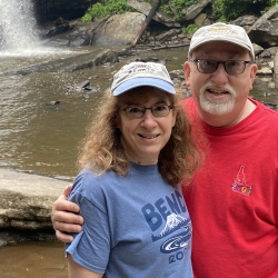 The Richmans in front of a waterfall