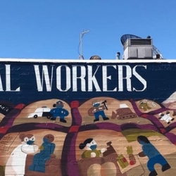 essential workers mural on side of building