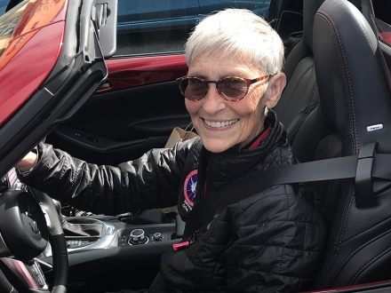 Emerita Ann Hallum driving her car