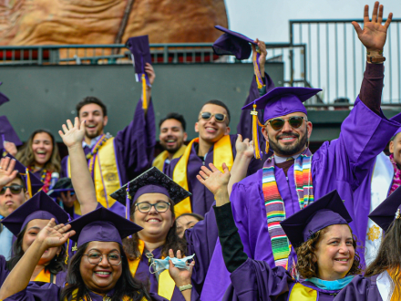 San Francisco State University students cheering during commencement