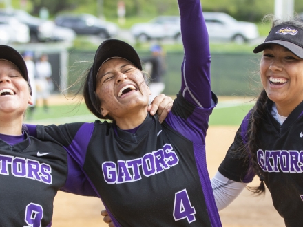 Women softball players celebrating